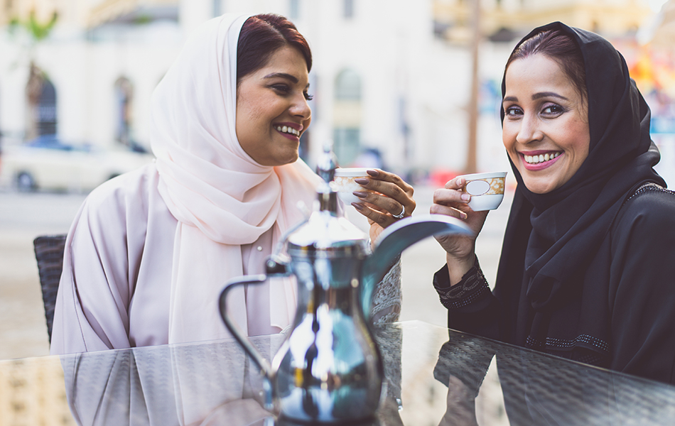 Two arabian girls spending time togehter outdoor making activities